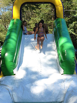 Girl sliding down water slide